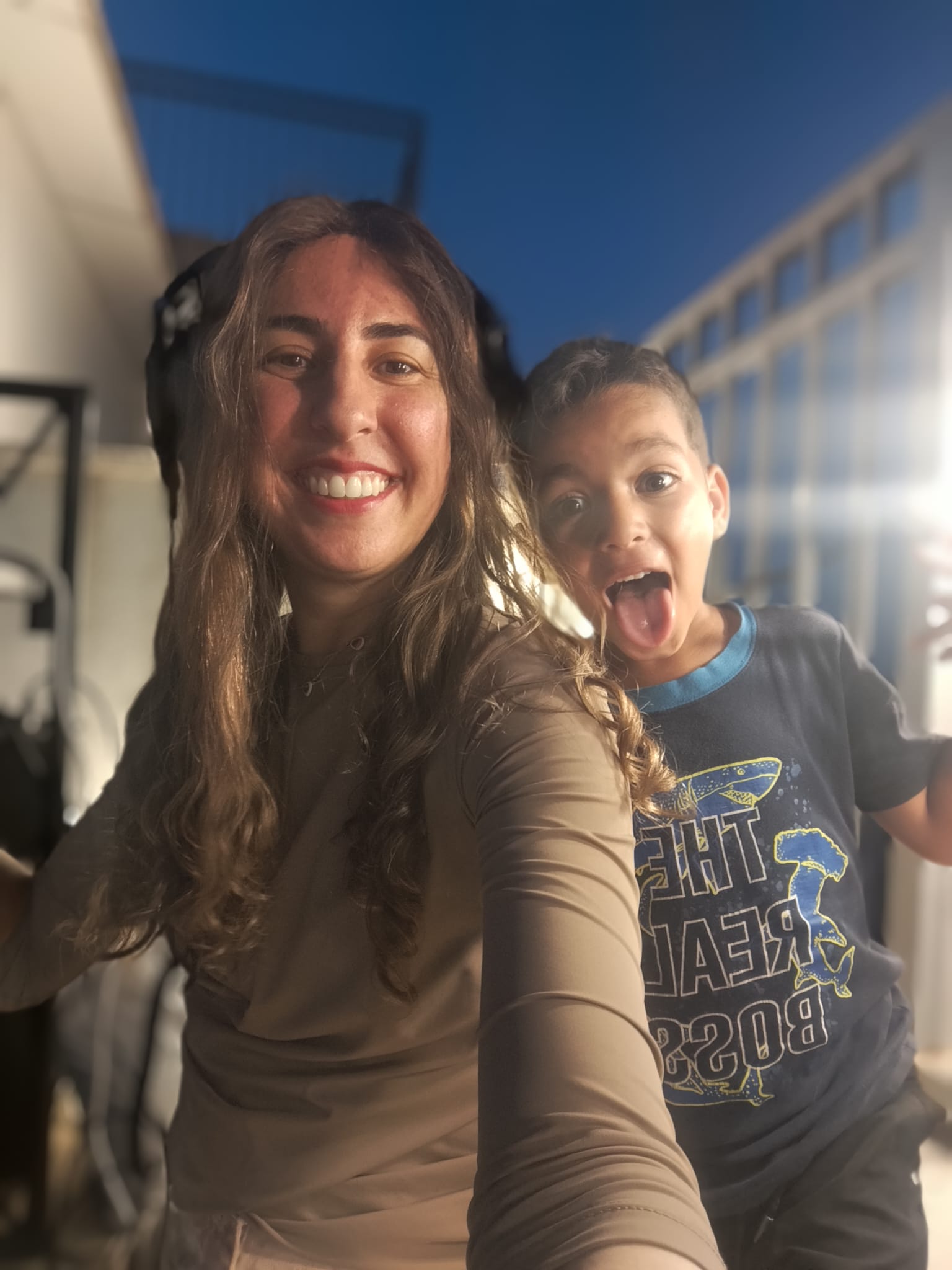 DJ Shira sharing a playful moment at an event